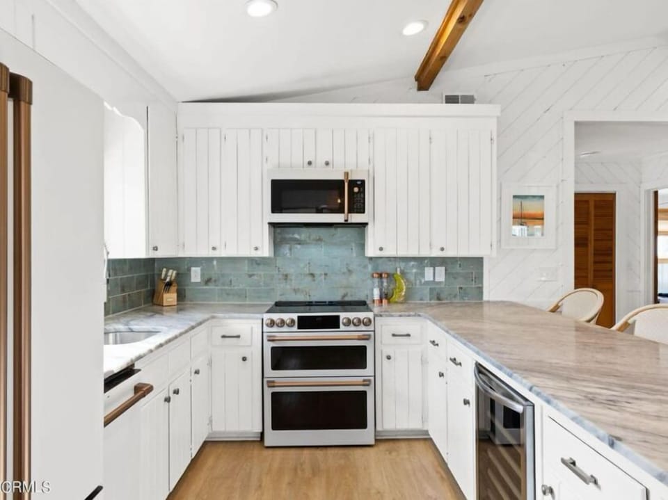 Kitchen with ample counter space to cook a great meal with gourmet appliances! 