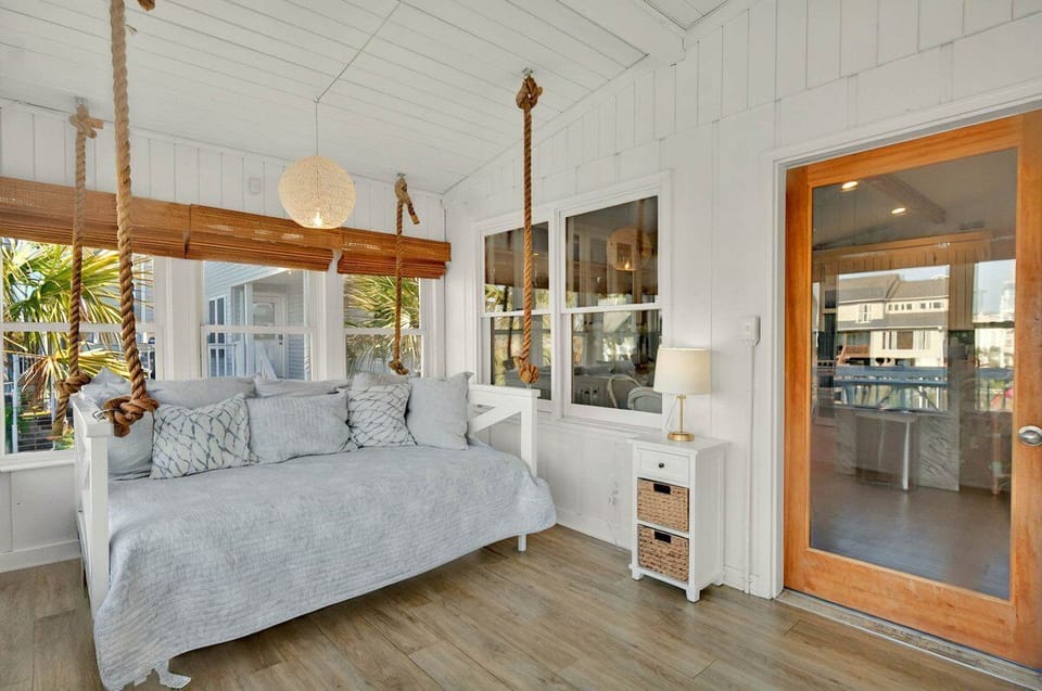 Extra queen bed in sunroom