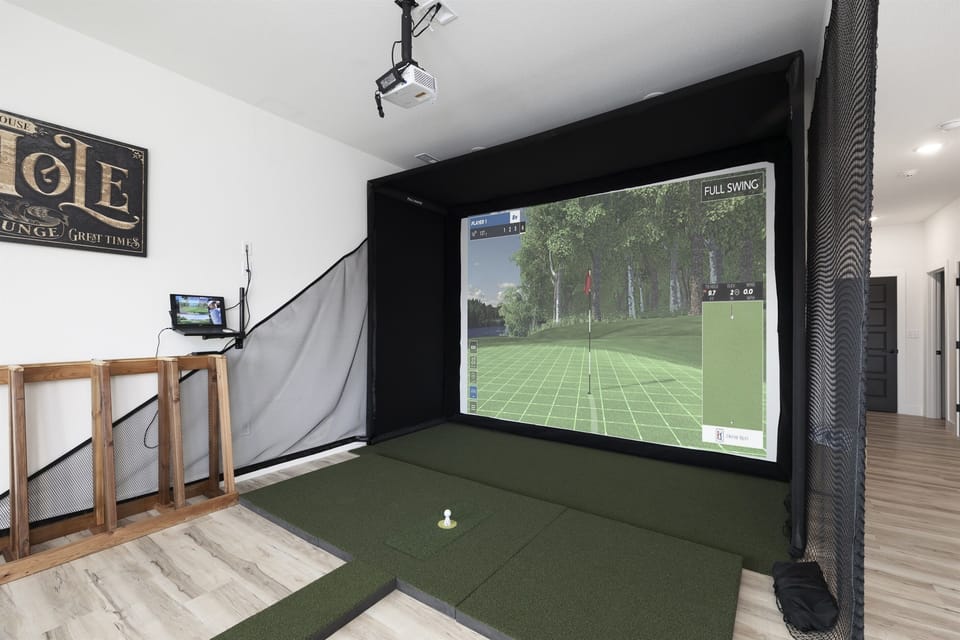 PGA Clubhouse - Basement Level: Golf simulator in Family & Game Room
