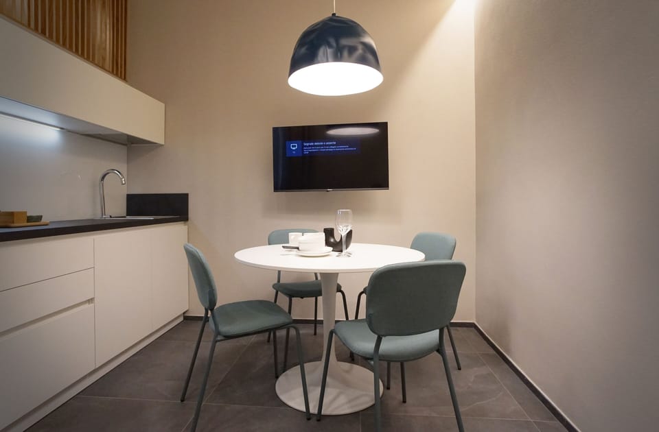 Deluxe Apartment | Living area | TV