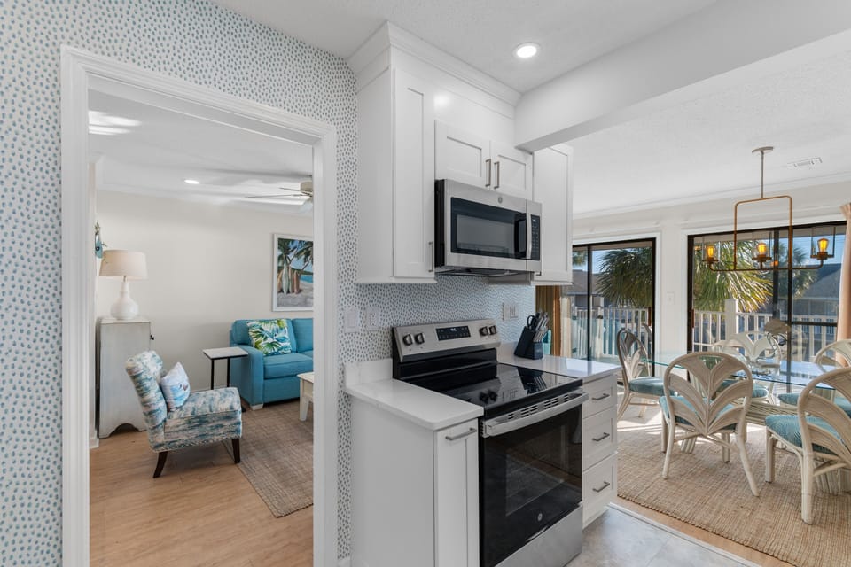 Your open-concept kitchen flows seamlessly into the living space, perfect for preparing meals while staying connected with loved ones.