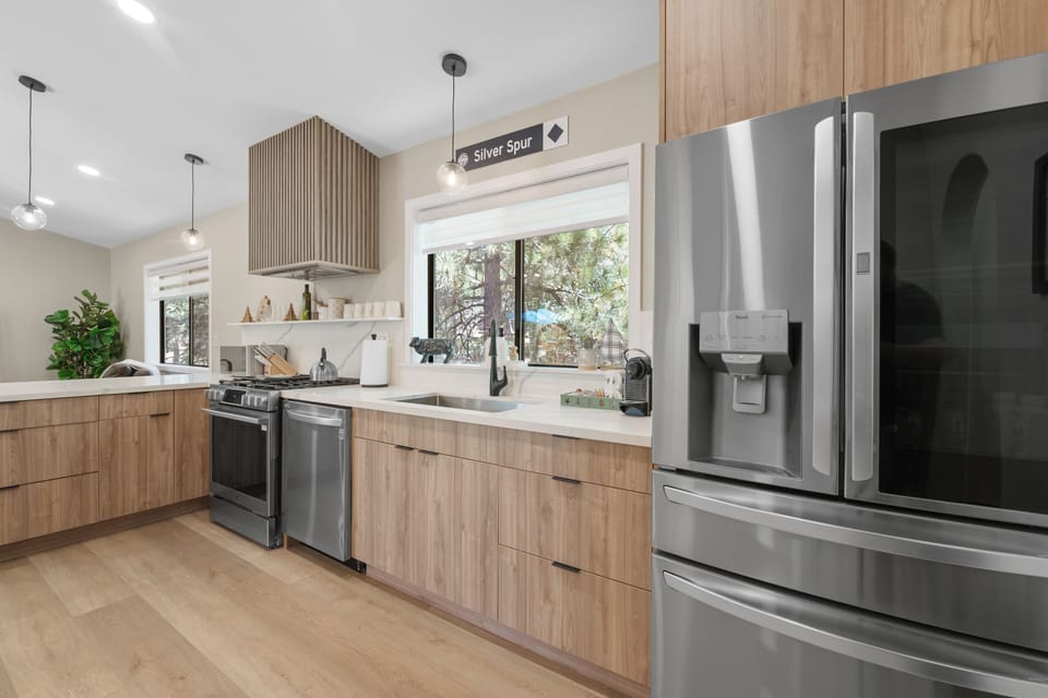 New kitchen with stainless steel appliances 