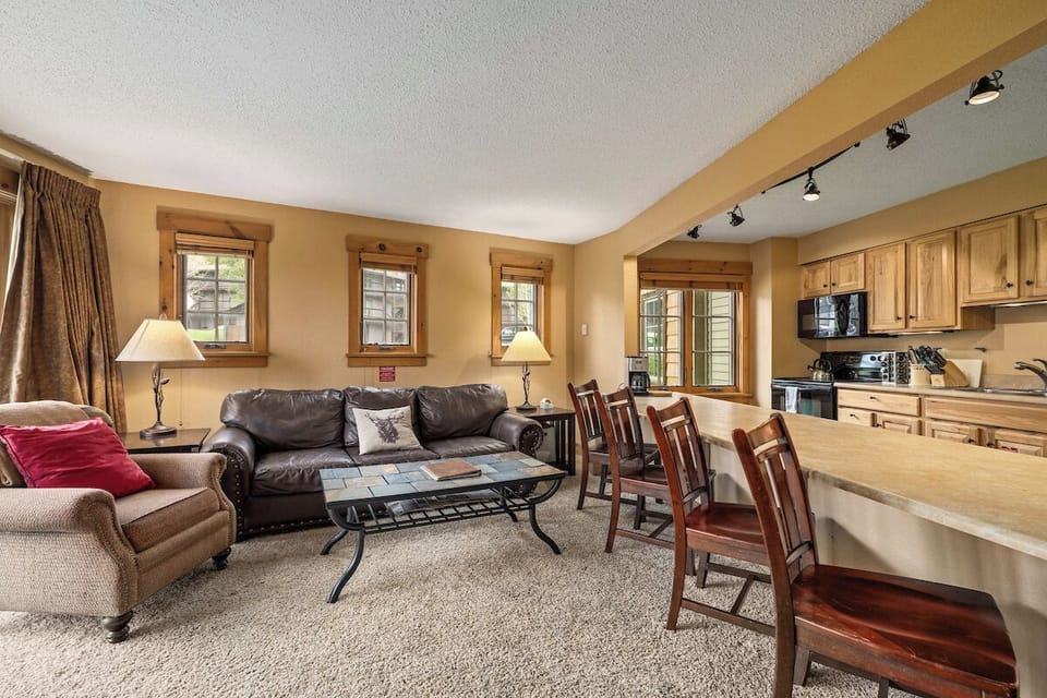 Large couch, chair, coffee table. 