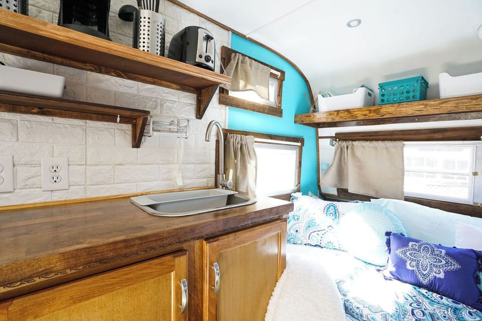 Kitchen and bed with shelving