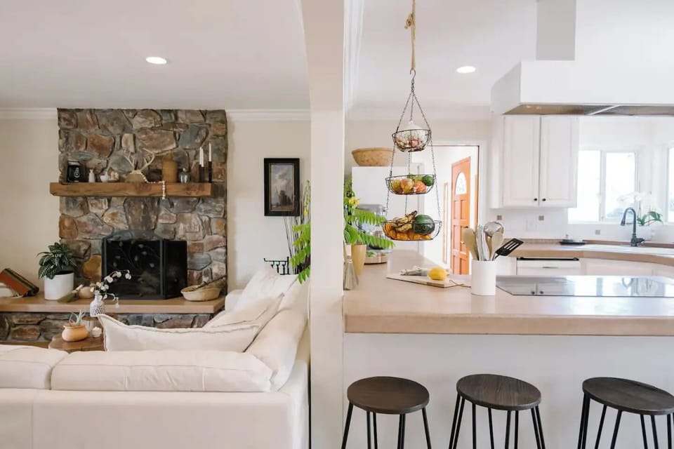 Spacious open-plan living area w/ a full kitchen & warm fireplace