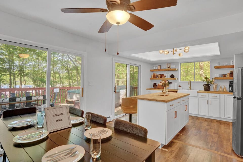 Gather around our open concept kitchen and sit in at our isolation table. Talk to each other like its 1998.