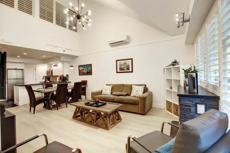 Large open concept living room & dining room with seating for 6