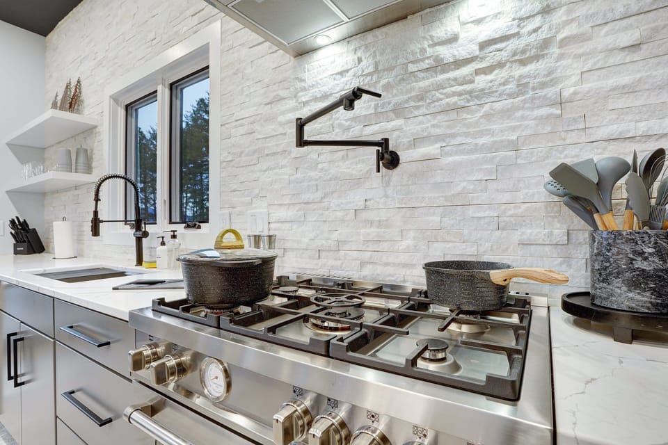 The kitchen features a Bertazzoni Gas Range
