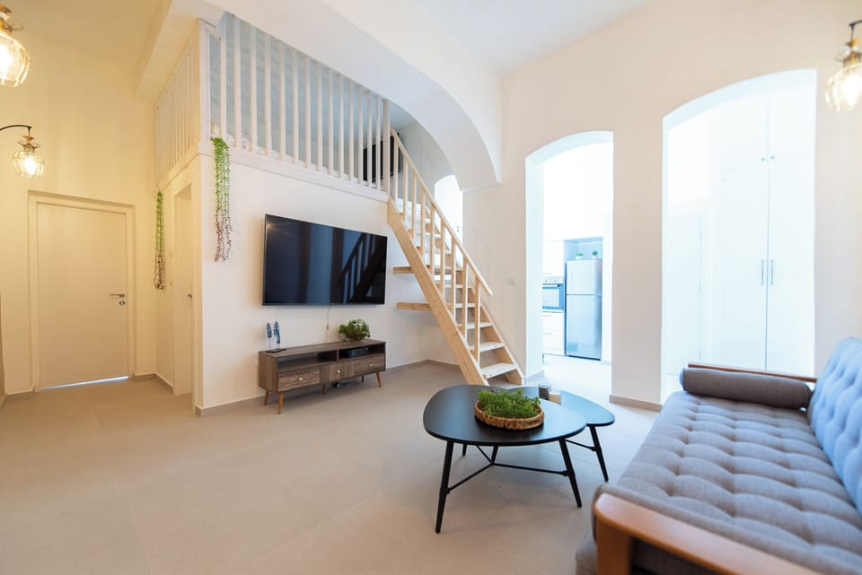 Luxury Apartment | Living area | 70-inch Smart TV with cable channels