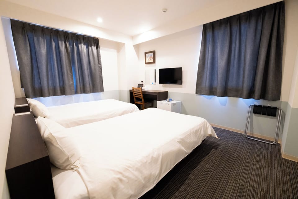 Desk, blackout drapes, WiFi (free), bed sheets