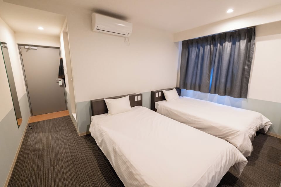 Desk, blackout drapes, WiFi (free), bed sheets