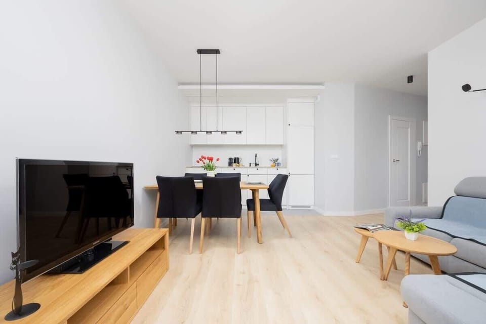 Bright area to dine or work, with chic seating and a clean aesthetic.