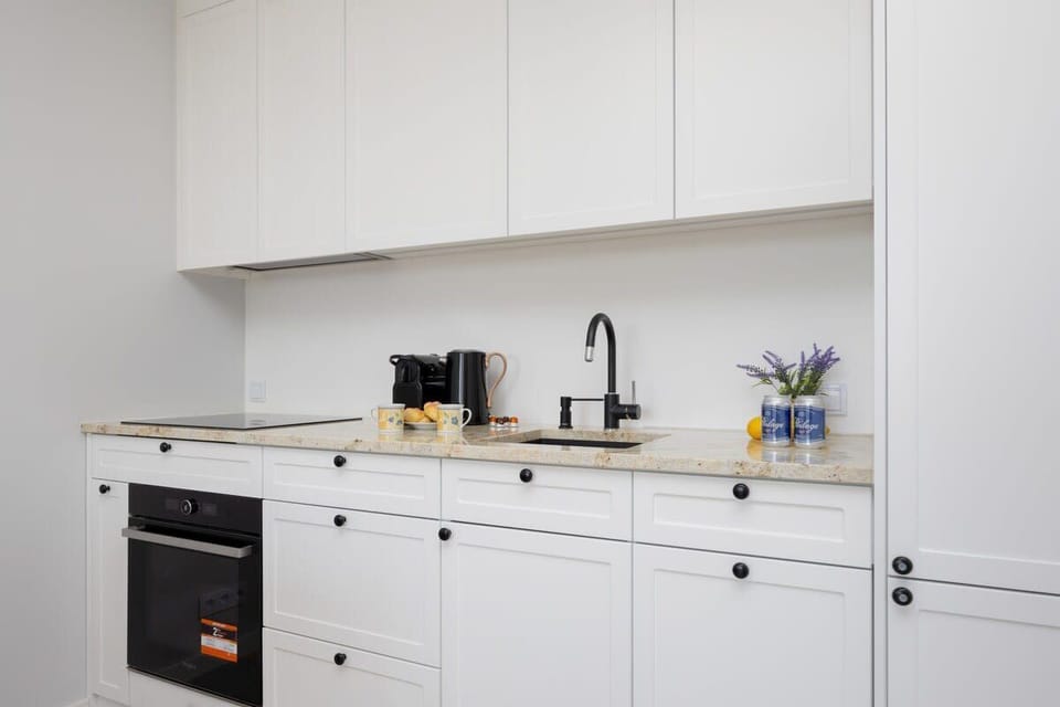 Compact kitchen with all essentials for cooking and dining.