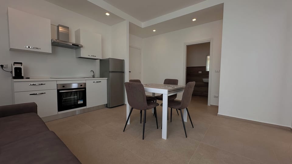 Deluxe Condo, 1 Queen Bed with Sofa bed, Garden View, Garden Area | Living area | Flat-screen TV