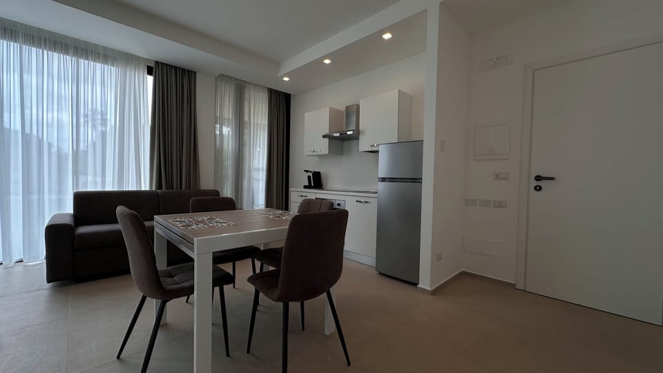 Deluxe Condo, 1 Queen Bed with Sofa bed, Garden View, Garden Area | Private kitchen | Full-size fridge, oven, stovetop, electric kettle