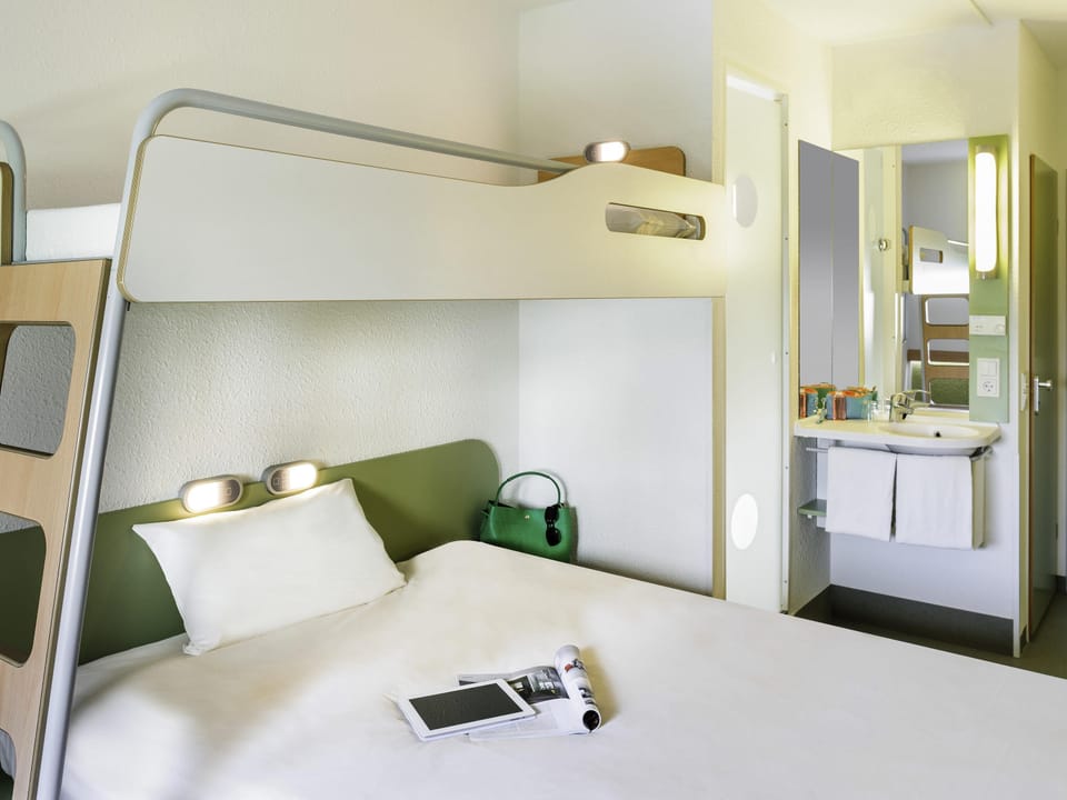 Hypo-allergenic bedding, desk, laptop workspace, blackout drapes