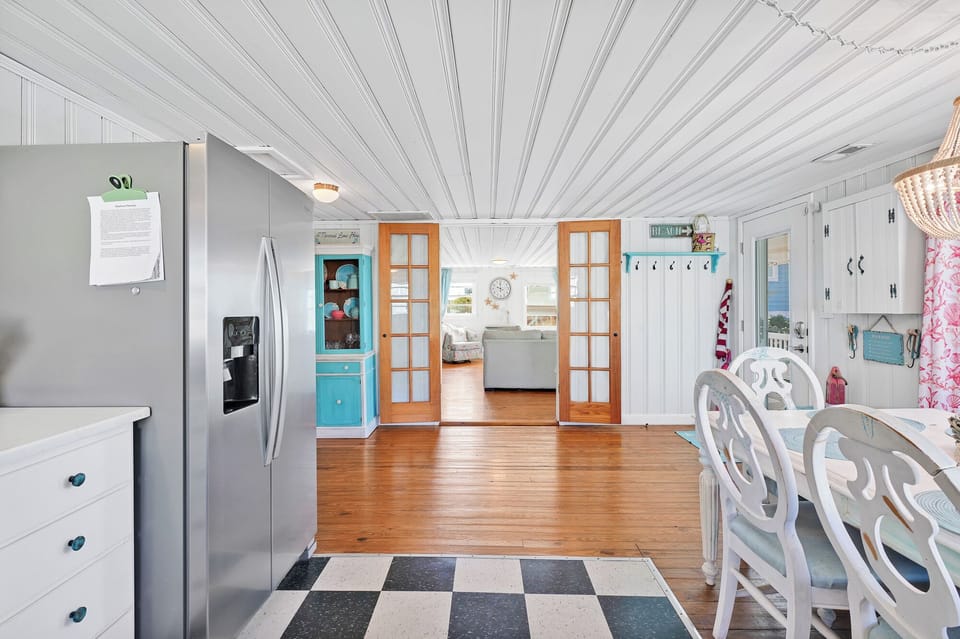 Entry from open eat-in kitchen to family room