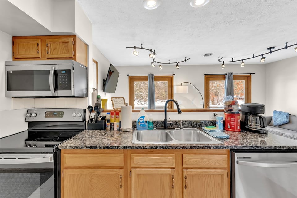 Kitchen with stainless steel appliances.