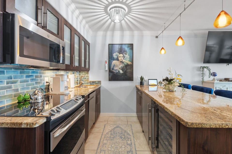 Functional kitchen with stylish bar stools for dining and socializing.