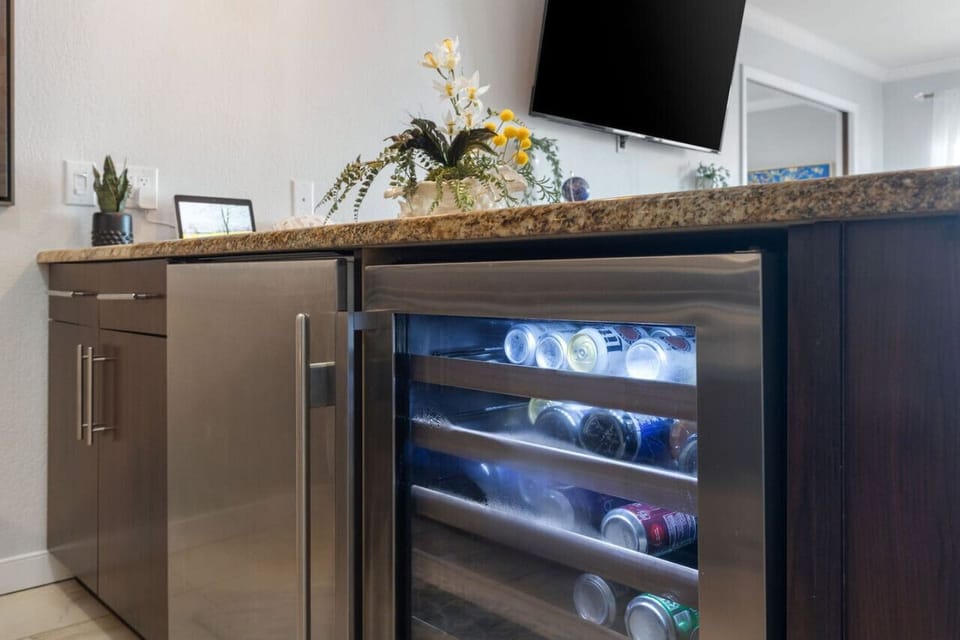 Gather around the kitchen bar for snacks, drinks, or conversation.