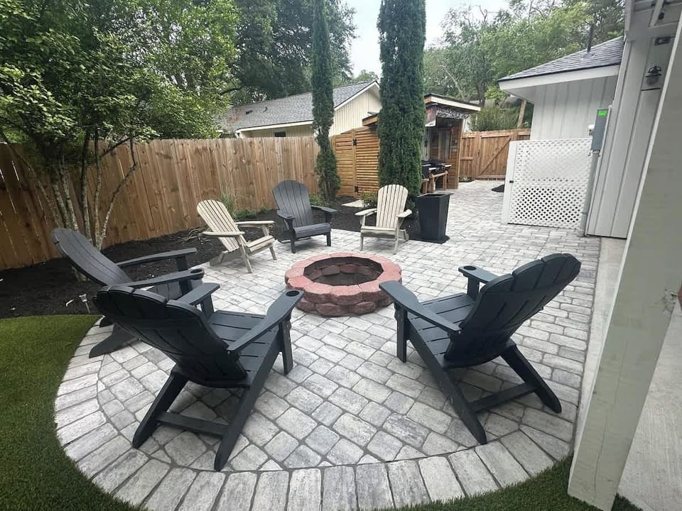 An inviting social hub featuring a circular stone fire pit.