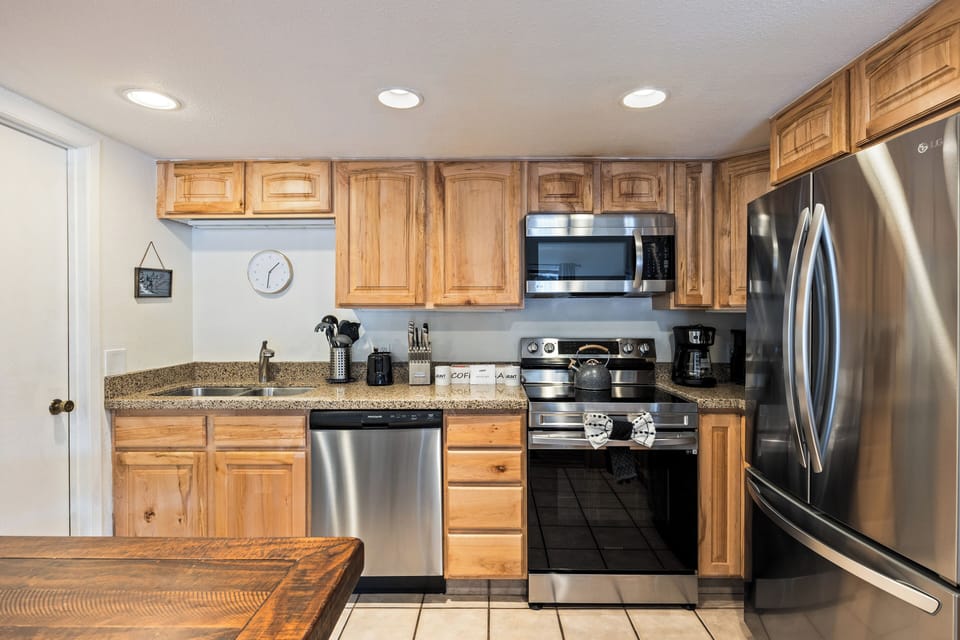 Spacious, fully stocked kitchen with stainless steel appliances, ample counter space, and everything you need to prepare meals at home.