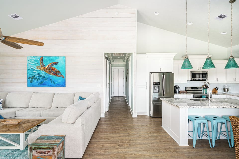 Enjoy the open concept kitchen, dining and living space. It is bright and airy!