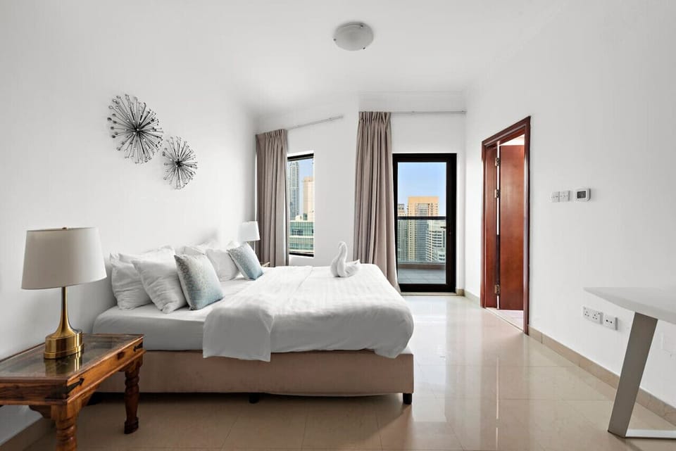 Bedroom: Bright and airy retreat with stunning city views and stylish decor awaits your stay!