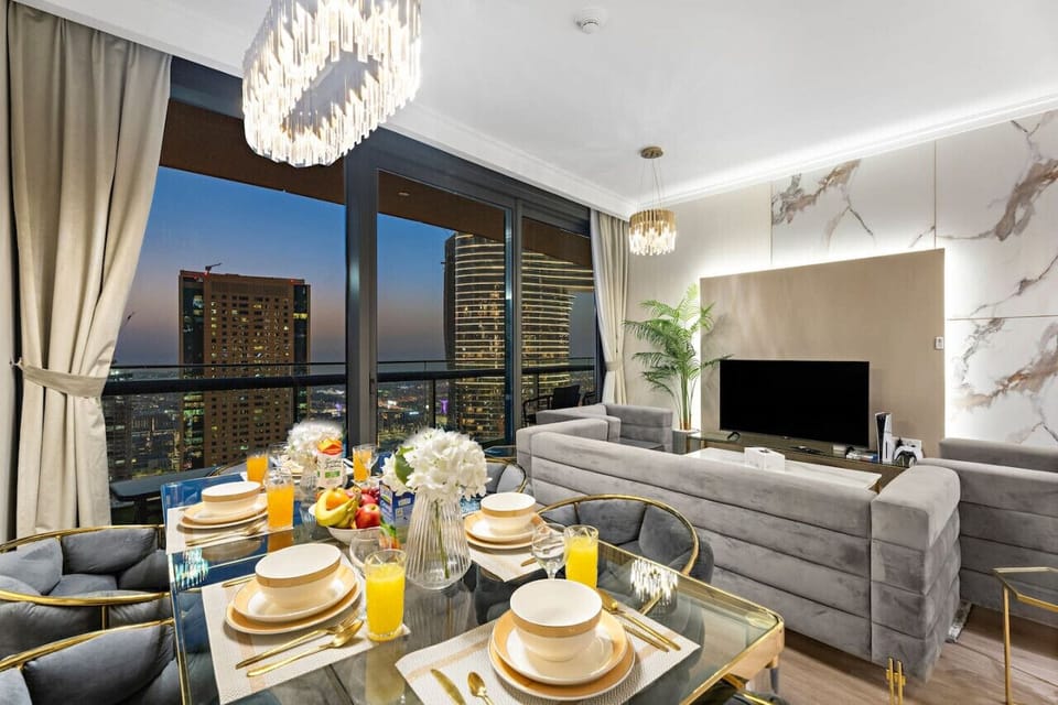 Dining Room: Savor city views while indulging in gourmet meals with elegant decor and chic lighting!