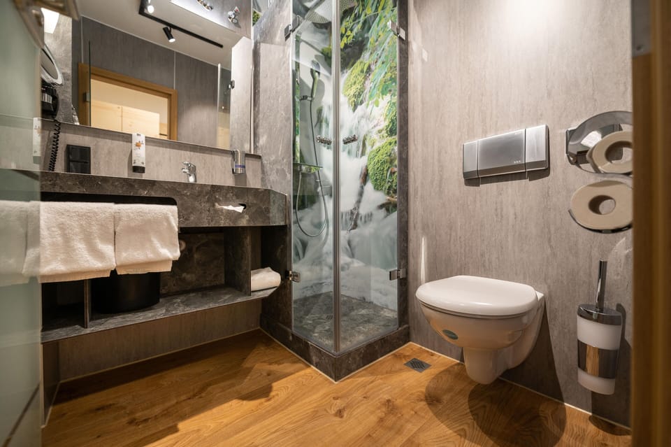Panoramic Double Room | Bathroom | Shower, rainfall showerhead, hair dryer, bathrobes