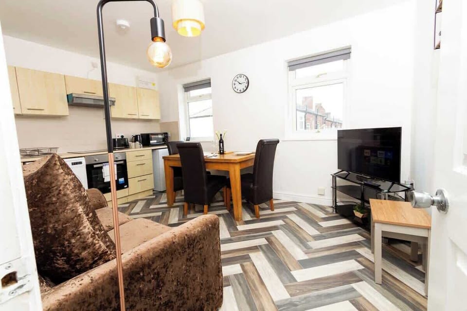 The living and dining space seamlessly blend together, providing a versatile area for relaxation and meals.