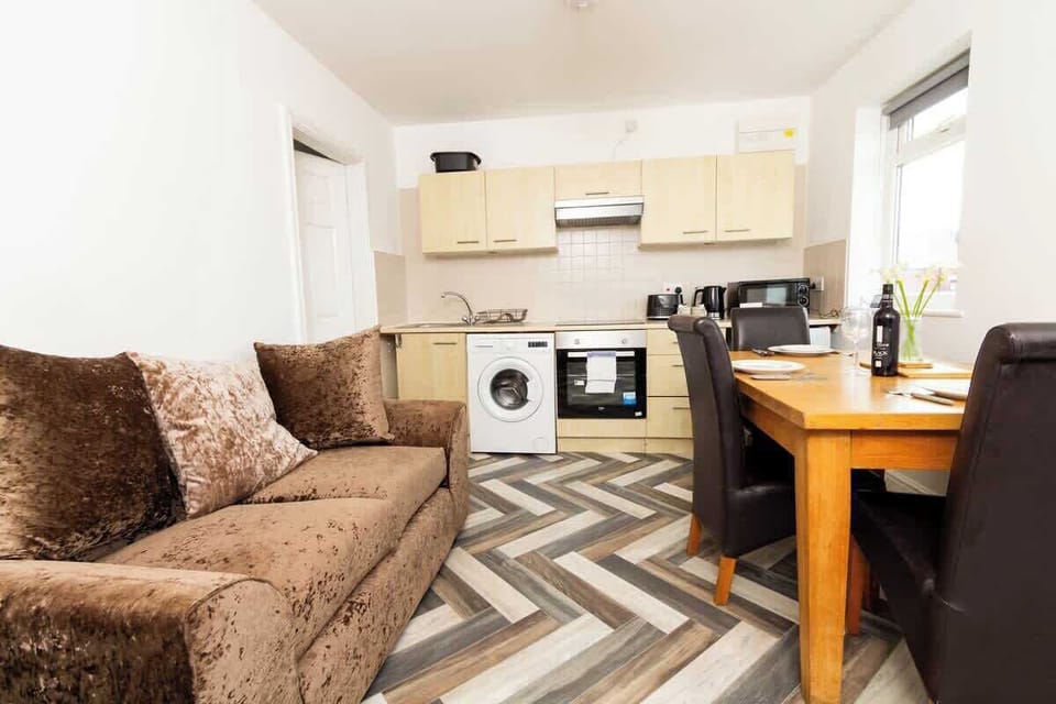 The living and dining space seamlessly blend together, providing a versatile area for relaxation and meals.