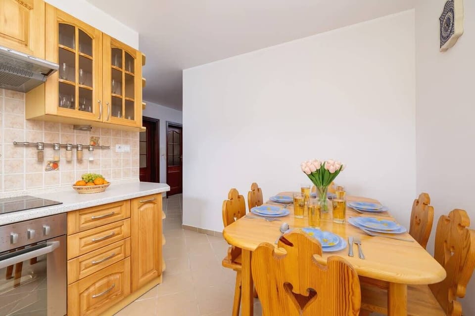 The kitchen's atmospheric decor complements the apartment's style.