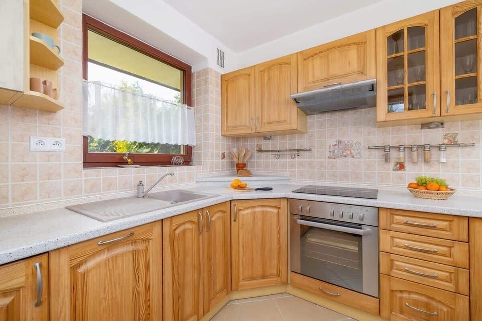 The kitchen offers a functional layout for convenient cooking. 