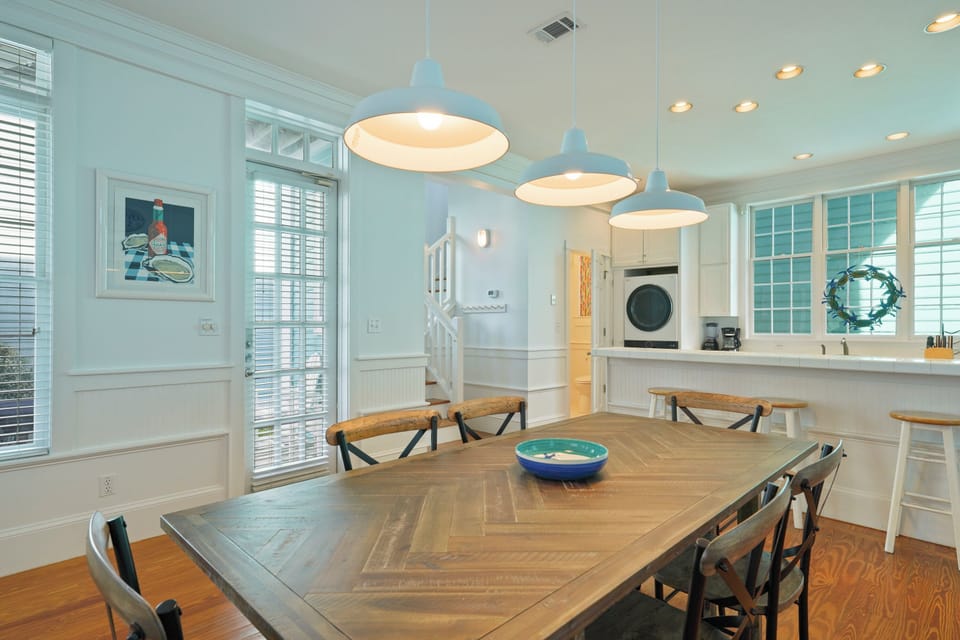 DINING AREA ALTERNATE VIEW TO KITCHEN W/BAR SEATING FOR THREE