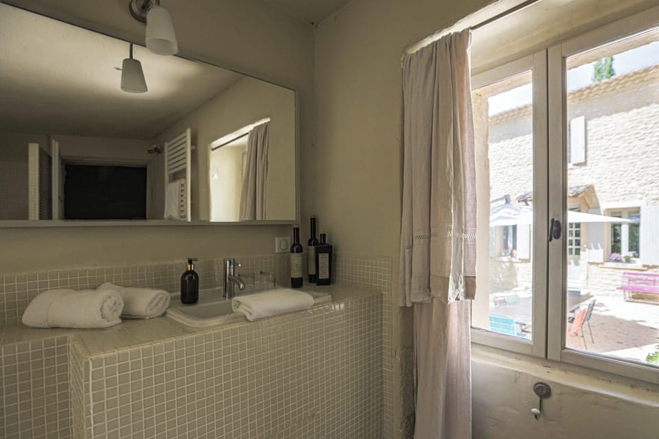 Comfort Double Room, 1 King Bed, Courtyard View | Bathroom | Shower, rainfall showerhead, hair dryer, bathrobes