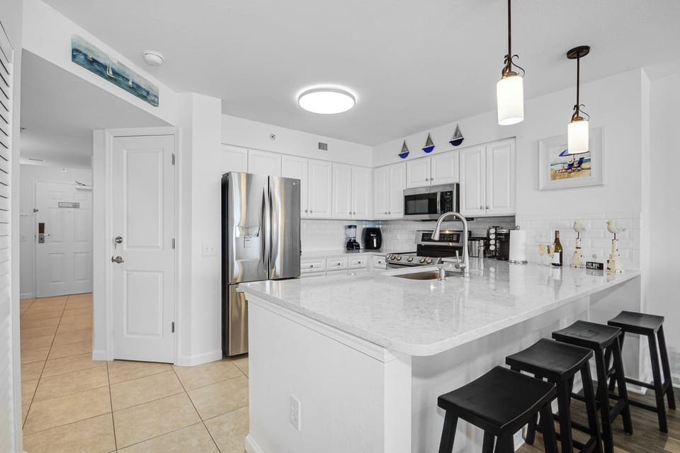 Prepare meals together in your bright, spacious kitchen with gleaming quartz counters and modern appliances.