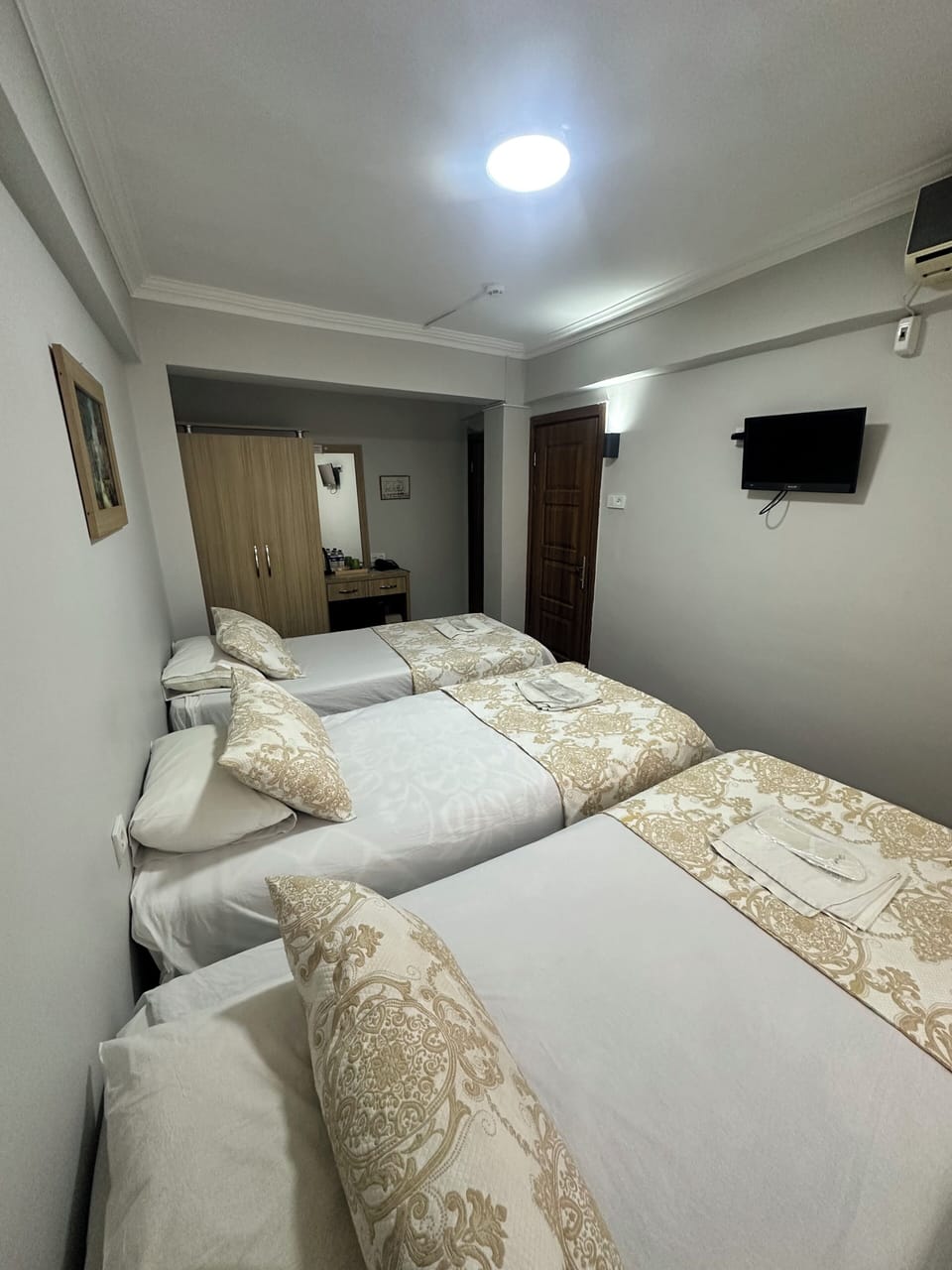 Comfort Triple Room | Minibar, laptop workspace, blackout drapes, soundproofing