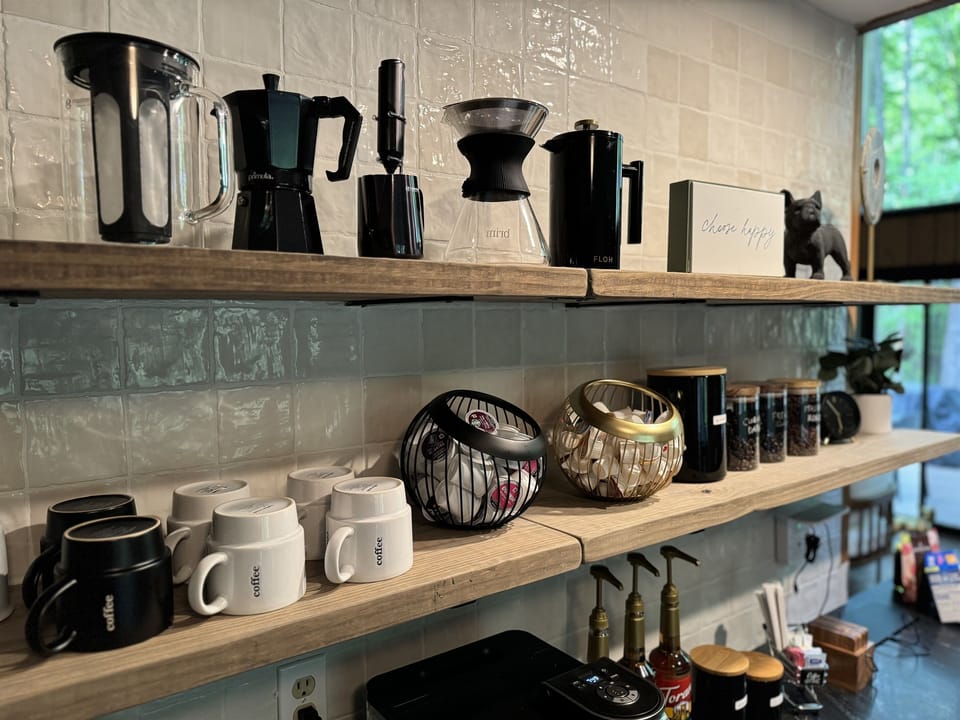 Craft your perfect morning with our fully stocked coffee bar.