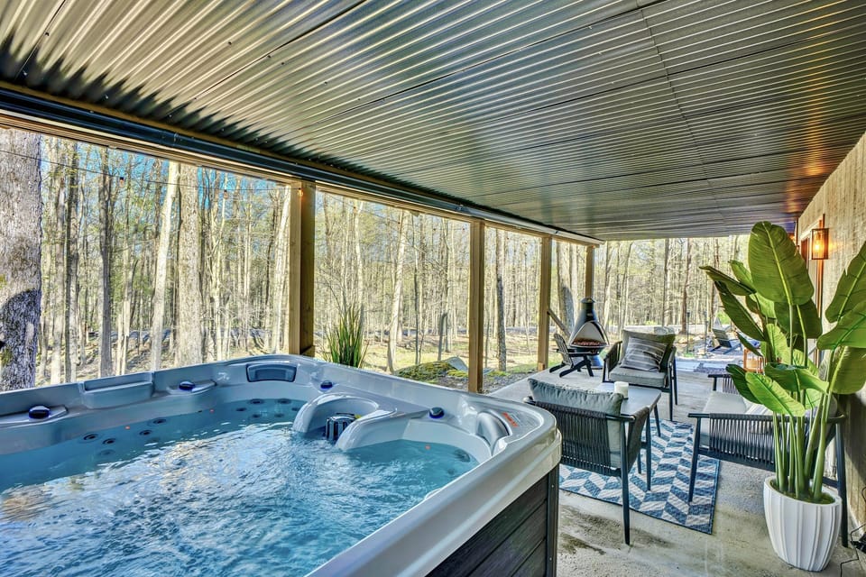 “Soak in the hot tub surrounded by trees — pure relaxation after a day outdoors.”