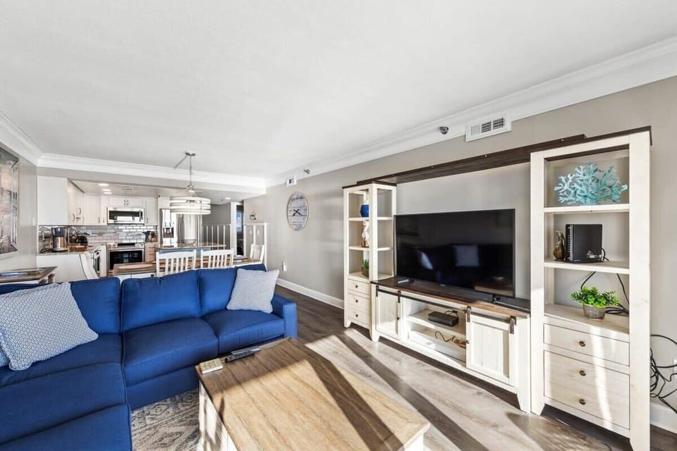 You'll love the tastefully decorated open-concept living room, dining room, and kitchen, all of which feature direct Ocean Views from the opposite angle