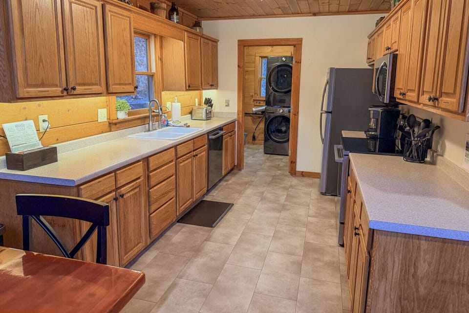 Everything you need, right where you need it—to include cabinet space to store groceries and supplies- cook, snack, or gather in this fully-stocked kitchen.