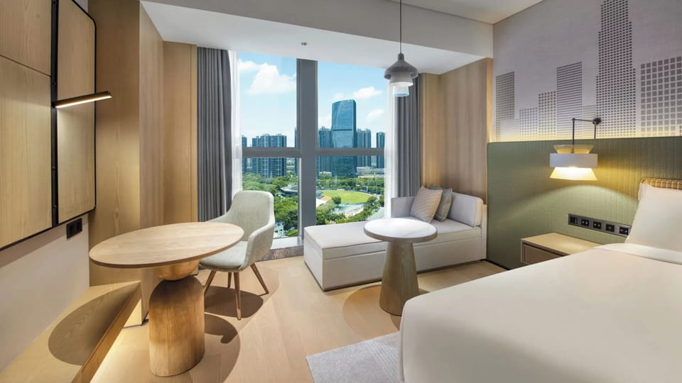 Premium Room, 1 King Bed, City View | Premium bedding, down comforters, memory foam beds, in-room safe