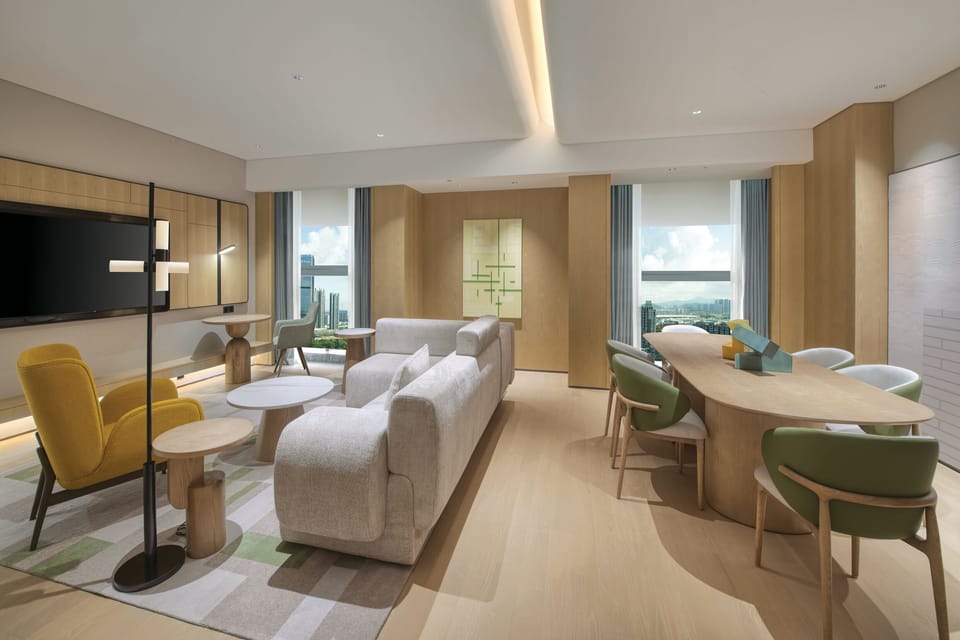 Suite, 1 Bedroom (Dining Area) | Living area | 72-inch TV with satellite channels