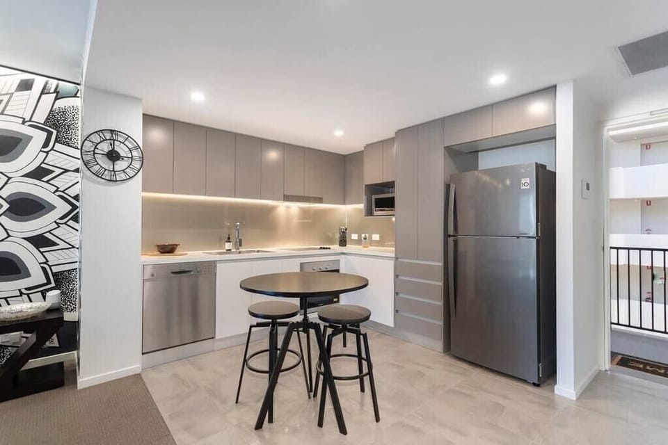 Fully functioning kitchen with a marble top bar table. Whiskey Stones can be found in the freezer.