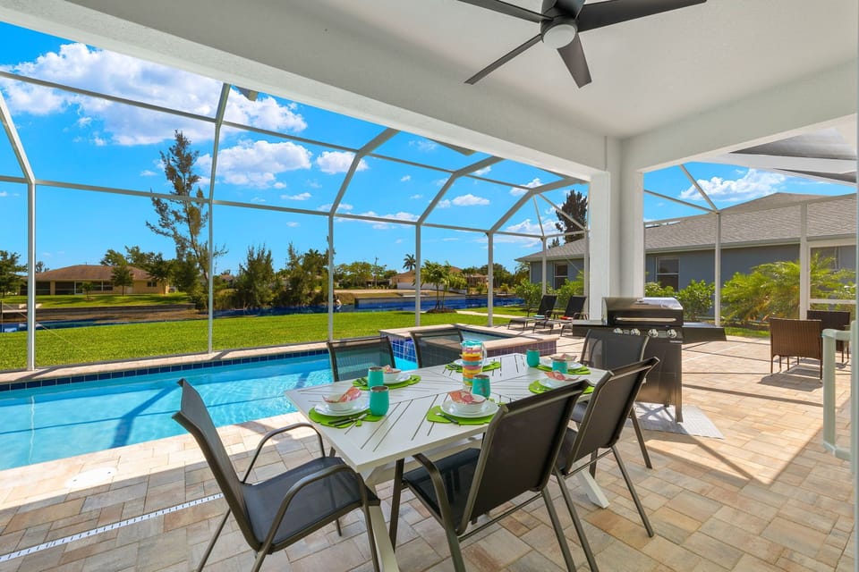 Enjoy your meals poolside with the dining area that seats 6
