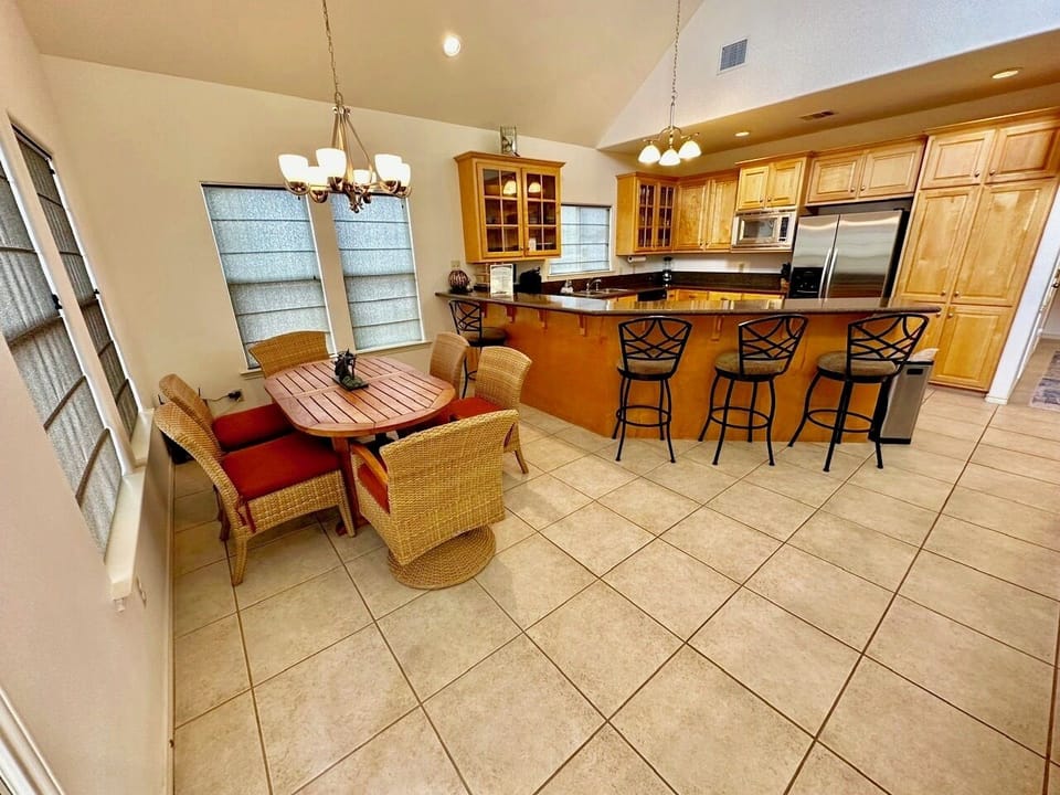 Entry view of dining and kitchen and island