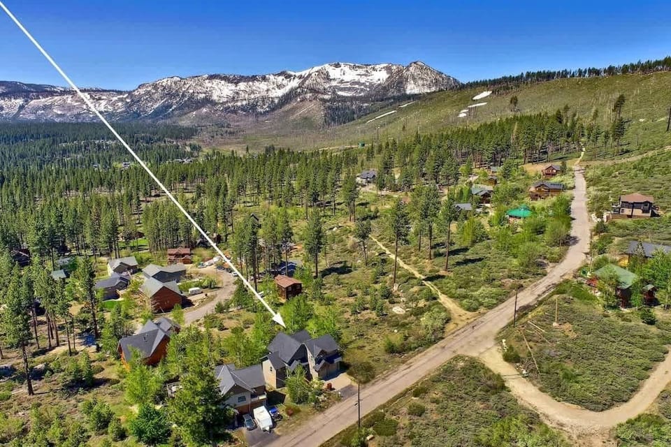 South Lake Tahoe vacation cabin nestled among towering pine trees in a peaceful forest setting, with hiking, biking and snowshoeing trails nearby and easy access to Tahoe attractions.
