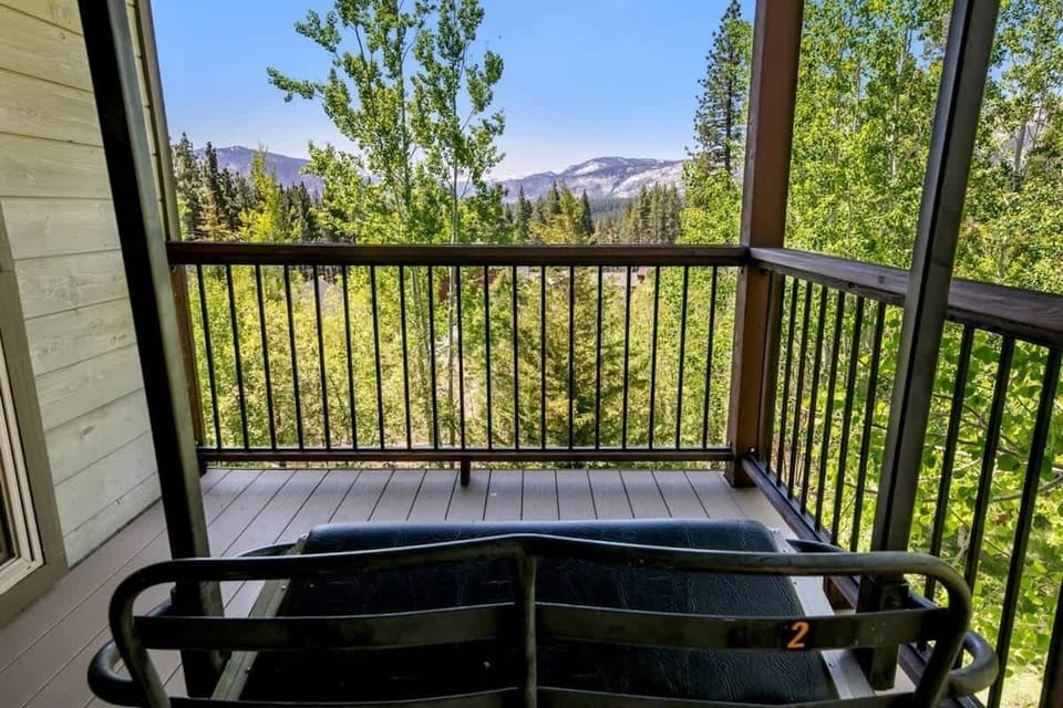 Private balcony at this South Lake Tahoe vacation cabin overlooking the surrounding pine forest, offering a peaceful outdoor space to enjoy fresh mountain air and the natural Tahoe setting. Retired chairlift.