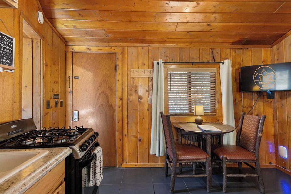 You enter the cabin by the dining table and bathroom